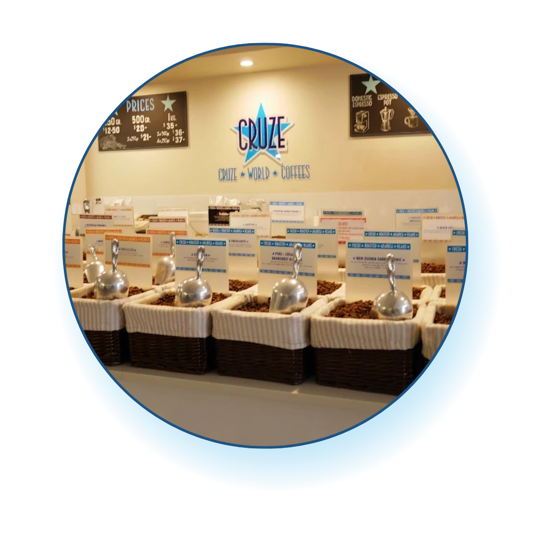 Cruze coffee shop interior with coffee beans and a visible logo.